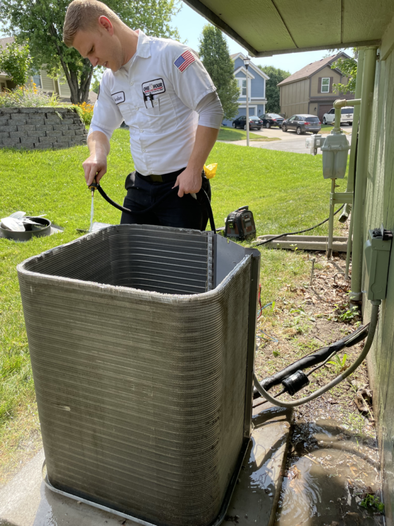 one hour heating and air conditioning performing air conditioner maintenance