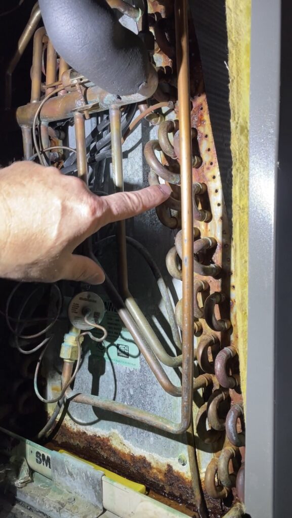 air conditioner coil with a refrigerant leak.